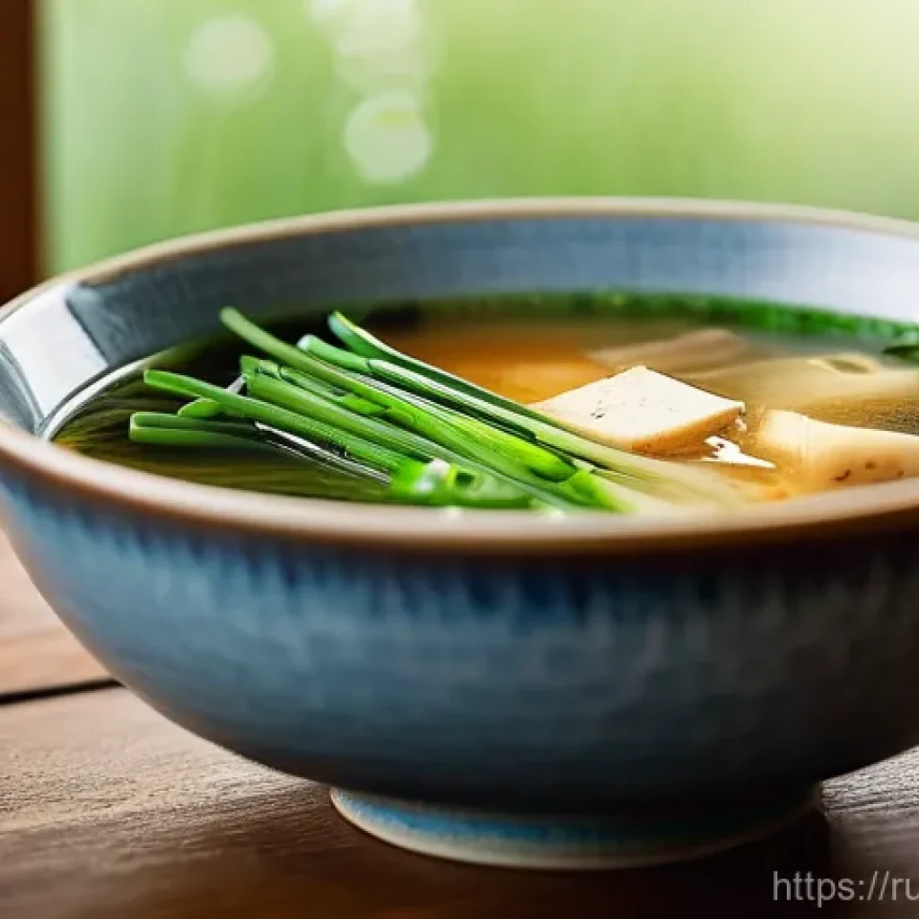 일본식 된장국 만드는 법 - **A comforting bowl of Miso soup, captured in a warm and inviting light.**
The soup is presented...