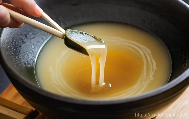 일본식 된장국 만드는 법 - **An artfully arranged still life showcasing the core ingredients for traditional Japanese Miso soup...